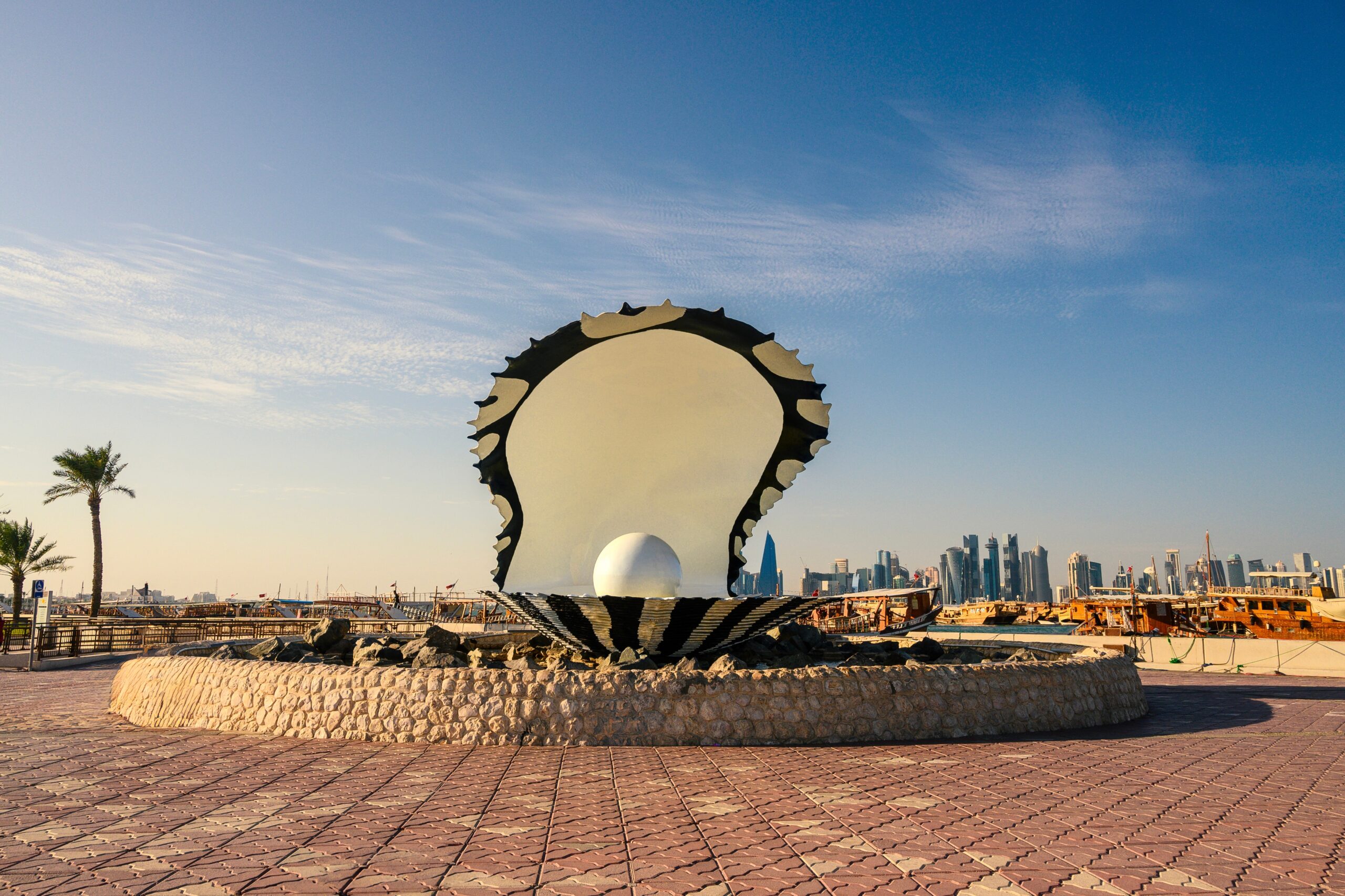 Pearl,Statue,Fountain,And,Tall,Buildings,Behind,It,In,Souq